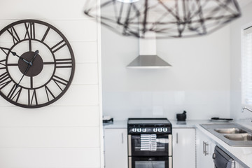 Contemporary Design Wall Clock on the Kitchen Wall