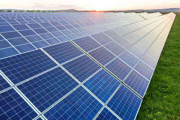 Blue solar photo voltaic panels system producing renewable clean energy on rural landscape and...