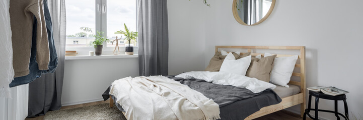 Fototapeta na wymiar Bedroom with wooden bed