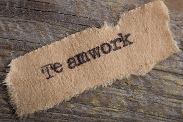 Teamwork word on a piece of paper close up, business creative motivation concept