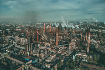 Aerial panoramic view of Factory or Plant Industrial Area with many pipes or chimneys with smoke. Heavy industry of Metallurgical Production industry landscape