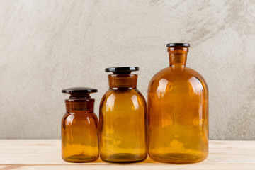 Retro pharmacy - vintage pharmacy bottles on wooden board