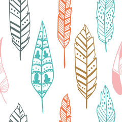 Seamless pattern with hand drawn feathers on a white background. Tribal Feathers. Vector design for wrapping paper, textile.