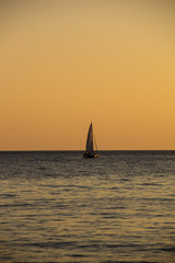 Obraz na płótnie Canvas Sailing Yacht In The Sea At Sunset. Black Sea.