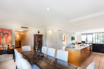 Well Furnished Kitchen and Dining Area with a Large Gothic Table