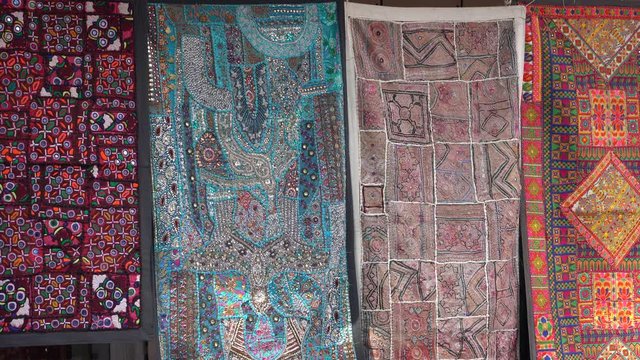 Patchwork carpet for sale in local street market. Udaipur, Rajasthan, India. Close up