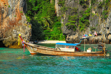 Typical Thai boat at the entrance of Loh Samah Bay beach, with, crystal clear water, ko phi phi...