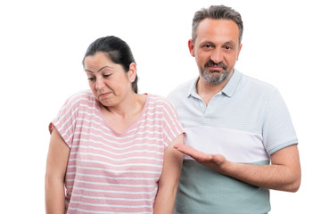 Obraz premium Man pointing at woman with disinterested expression