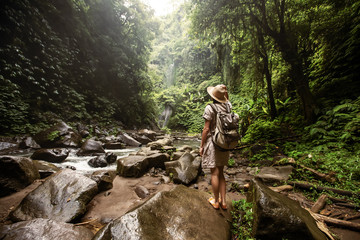 Woman near Nung Nung waterfal on Bali, Indonesia