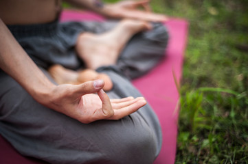 Yoga man meditating at sunset. Male model of meditation in serene harmony