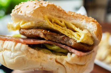 eat delicious hamburger at a restaurant