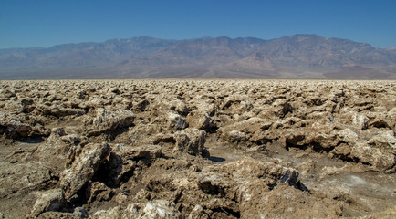Fototapeta na wymiar Fascinating landscape, mountains, blue sky - the mystical Devil's golf course, Death Valley National Park