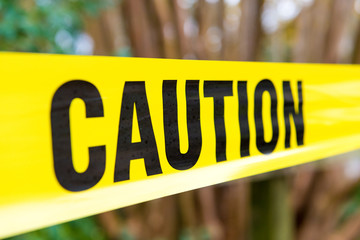 Close-up on yellow Caution tape as safety concept