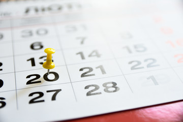 Thumbtack in calendar concept for important date or busy day, appointment and meeting reminder....