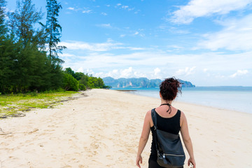 Fototapeta premium Young girl woman female on Beautiful Tropical Beach PP Island, Krabi, Phuket, Thailand blue ocean backgroundWomen items vacation accessories for holiday long weekend guide choice idea for planning t