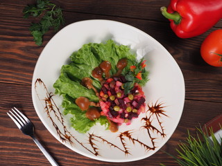 Venegret salad in a plate with lettuce and pickled mushrooms