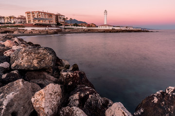 Lighthouse illuminating over the sea