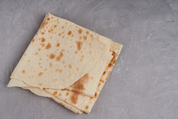 thin armenian bread on gray background