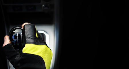Gear lever. Manual Transmission. Hand on the gear shift in the car.
