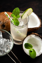 Coconut water drink on dark background