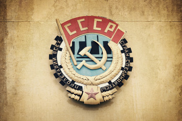 Soviet union CCCP emblem with hammer and sickle on a wall