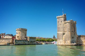 Medieval towers at the entrance of the port of La Rochelle, France. View from the ocean