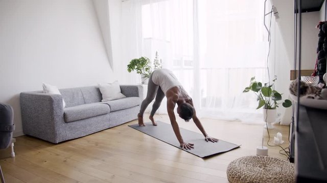 Woman exercising in living room