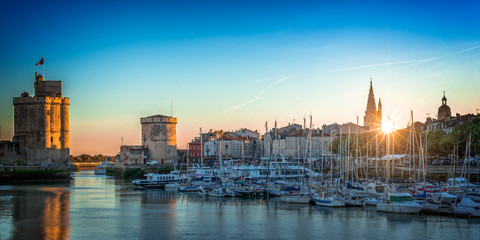 Panorama of the old harbor of La Rochelle, France at sunset - obrazy, fototapety, plakaty