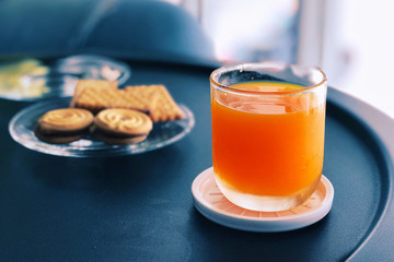 Orange juice an cookie in the afternoon brake time.