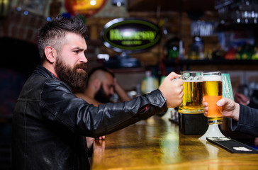 Cheers concept. Men hipster hold mugs filled with cold tasty beer in bar. Friday leisure tradition. Beer mugs at bar counter defocused background. Glasses with fresh lager draft beer with foam