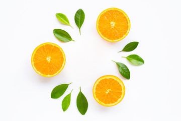 Fresh orange citrus fruit with leaves isolated on white background.