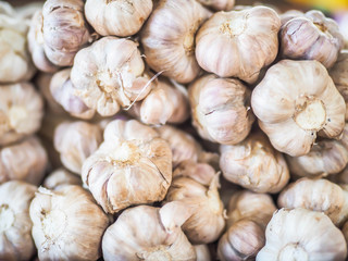 Closeup of bunch of garlic in local market.