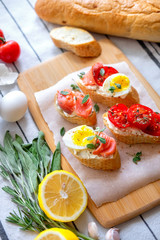 Toasted Bread With Mozzarella, Eggs And Tomatoes