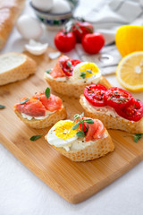 Fototapeta na wymiar Toasted Bread With Mozzarella, Eggs And Tomatoes