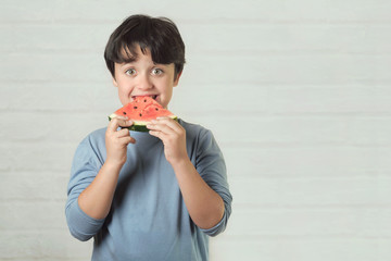 happy child eating watermelon