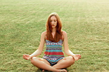 Young girl doing yoga outdoor