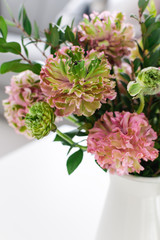 Obraz na płótnie Canvas Bouquet of beautiful pink and green ranunculus flowers