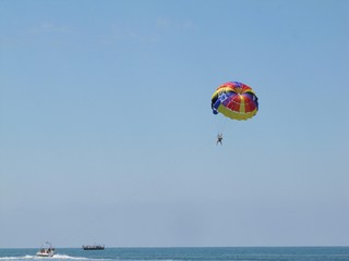 Fototapeta na wymiar parasailing on the beach