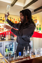 Young boy holding a wine bottle