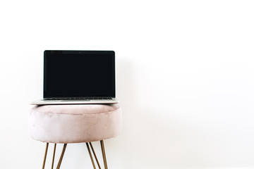 Copy space mockup screen laptop on stylish stool on white background. Minimalist blog, website,...