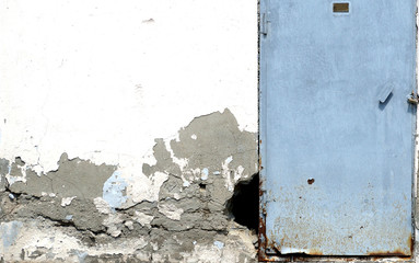 the door is closed and the hole in the wall is near