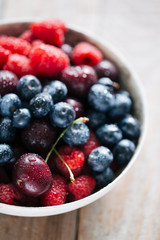 blueberries and raspberries in a bowl