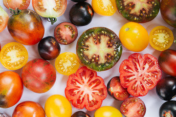 vibrant farmer tomatoes top view on white background