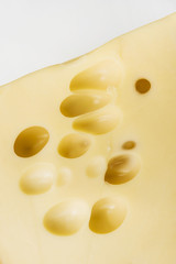 Maasdam cheese on white background
