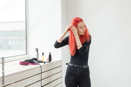 Beautiful Red Haired Girl With Long Hair She Is Weaves A Braid