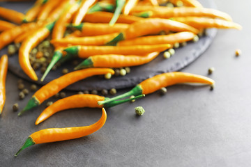 Hot orange pepper. Chilean pepper on a black.
