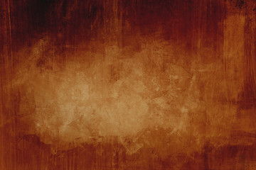 Dark orange grungy background with spotlight background