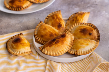 Fresh baked Empanadillas, small filling tuna pies. Popular snack Latin American cultures  and Spain.