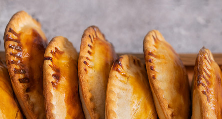 Fresh baked Empanadillas, small filling tuna pies. Popular snack Latin American cultures  and Spain.