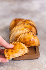 Fresh baked Empanadillas, small filling tuna pies. Popular snack Latin American cultures  and Spain.
